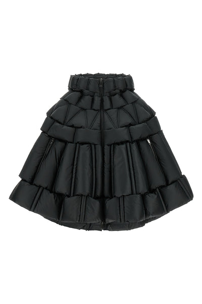 the raxxy cape redefines the volumes of outerwear through a complex three-dimens