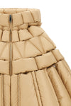 the raxxy cape redefines the volumes of outerwear through a complex three-dimens
