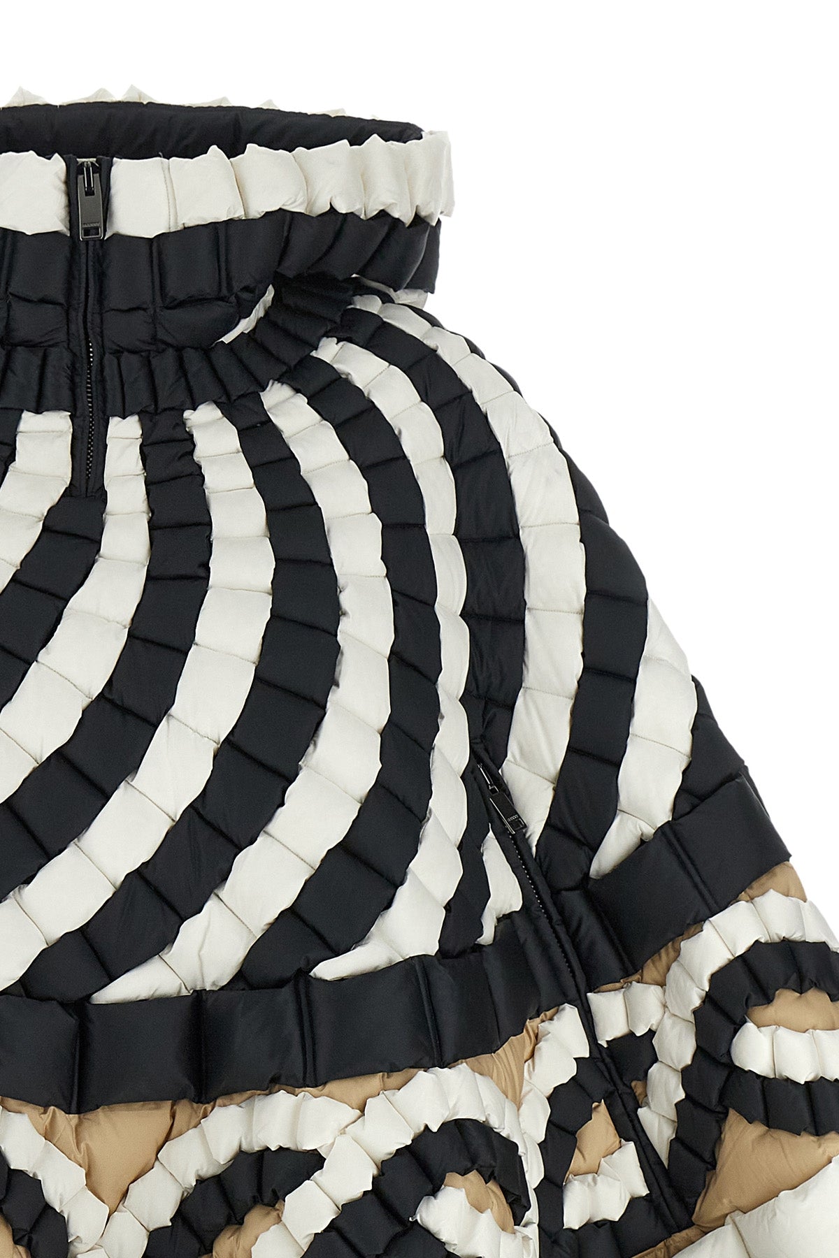 the raxxy cape redefines the volumes of outerwear through a complex three-dimens