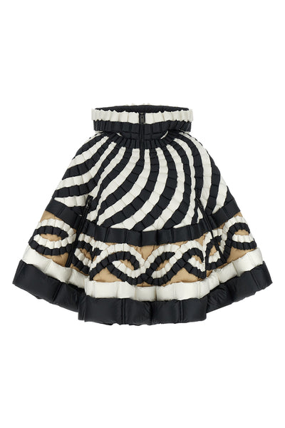the raxxy cape redefines the volumes of outerwear through a complex three-dimens
