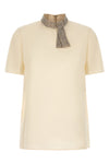 the valentino garavani short-sleeved top is made of fine crêpe de chine silk