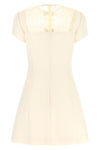 the valentino garavani mini dress expresses a refined sartorial vision through a