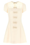 the valentino garavani mini dress expresses a refined sartorial vision through a
