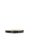 carved leather belt with shimmering buckle