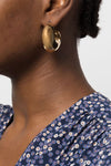 gold metal earrings shiny crescent