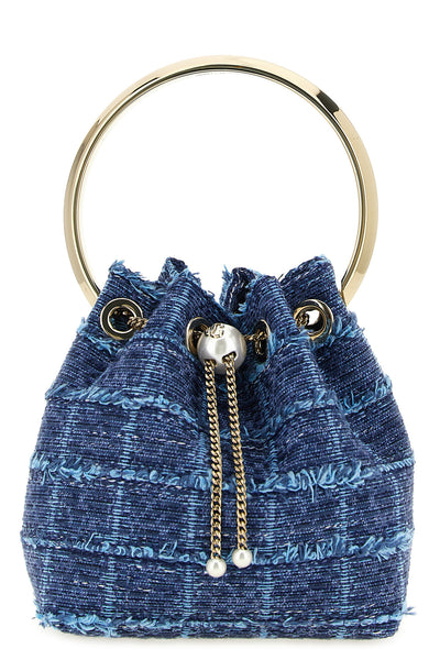 the jimmy choo bucket bag features a structured silhouette made of compact denim
