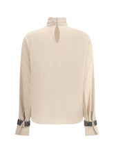 BRUNELLO CUCINELLI S silk turtleneck blouse with precious bracelets