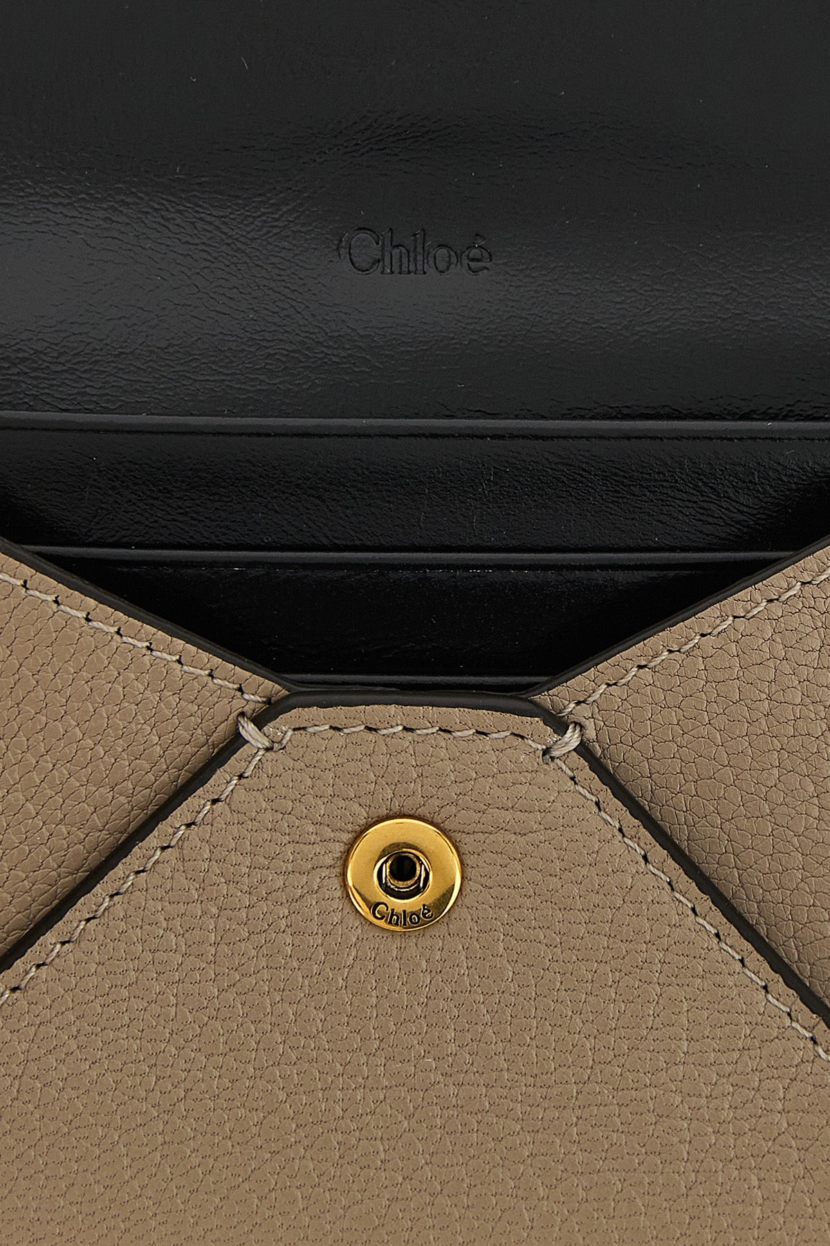 the chloé envelope card holder is made of fine garnet goat leather in a versat
