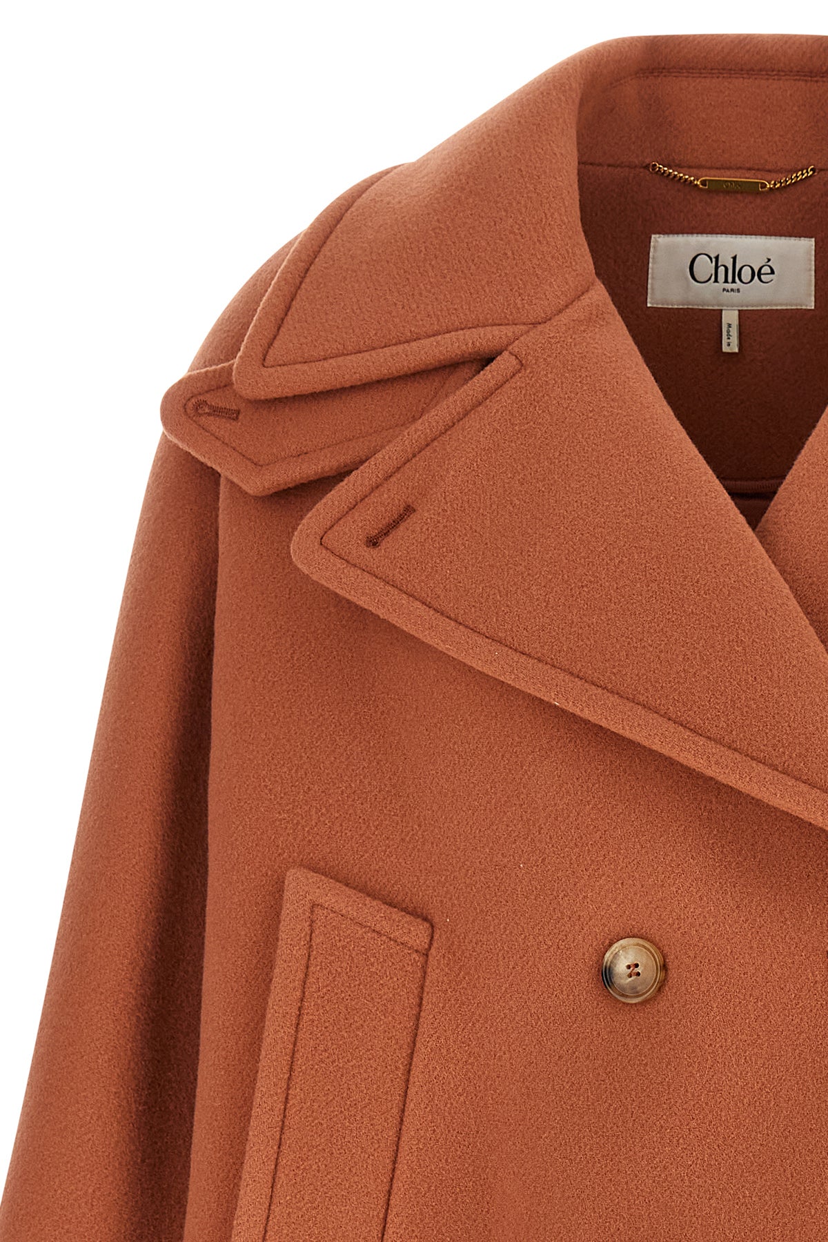 the chloé short coat defines the contemporary outerwear through a structured and