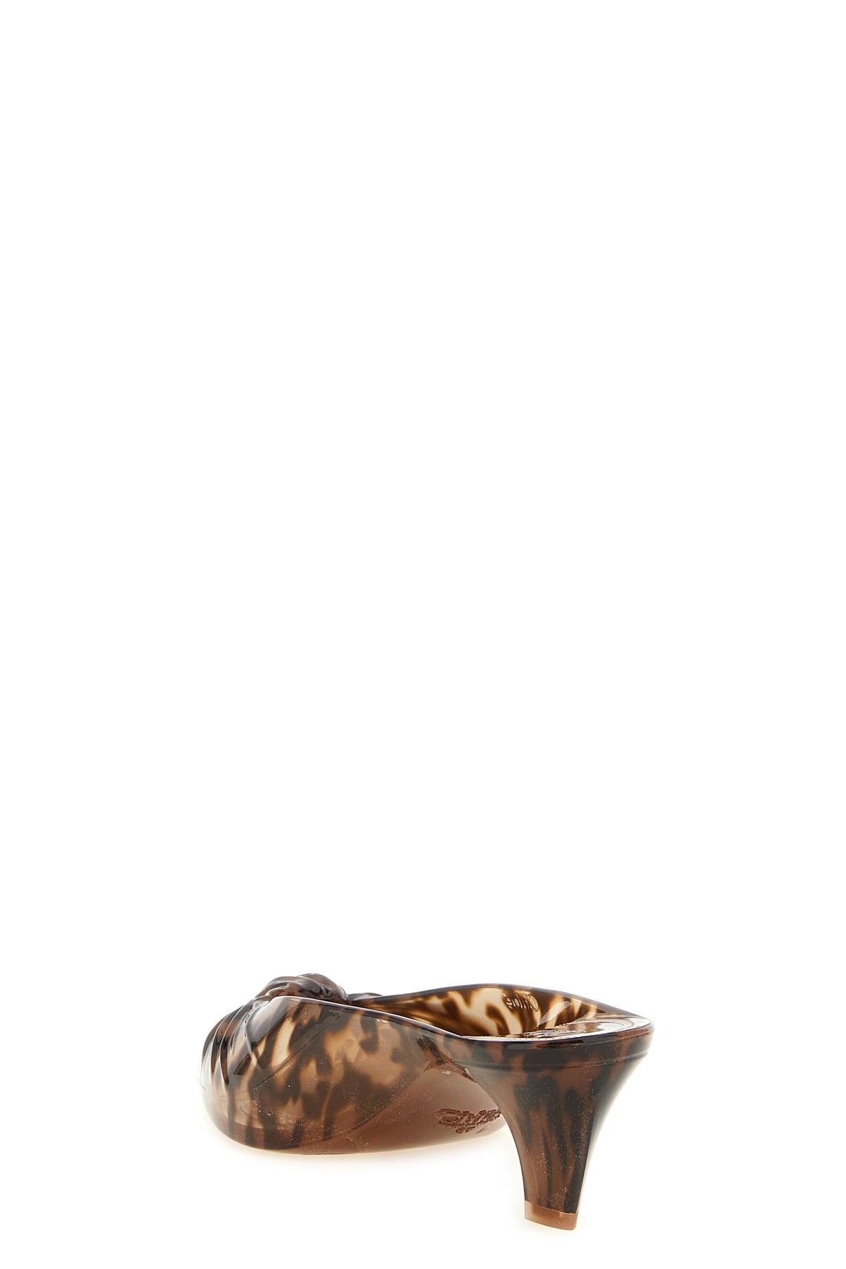 the chloé jelly sabot redefines the codes of summer footwear through a sculptura