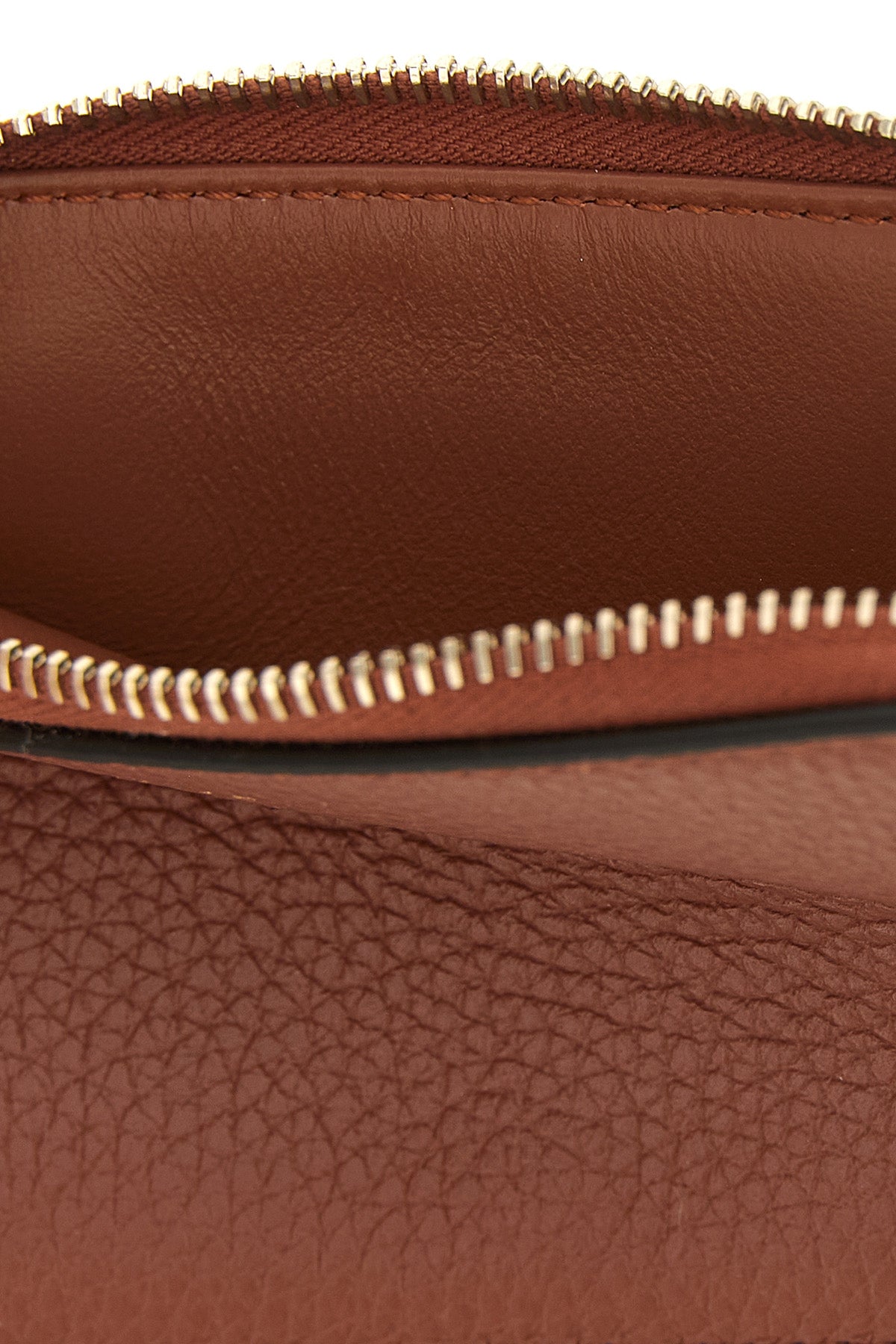 the chloé alphabet wallet is made of fine garnet calf leather and shiny in a w