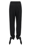 chloé trousers redefine contemporary tailoring through fluid volumes and unexpec