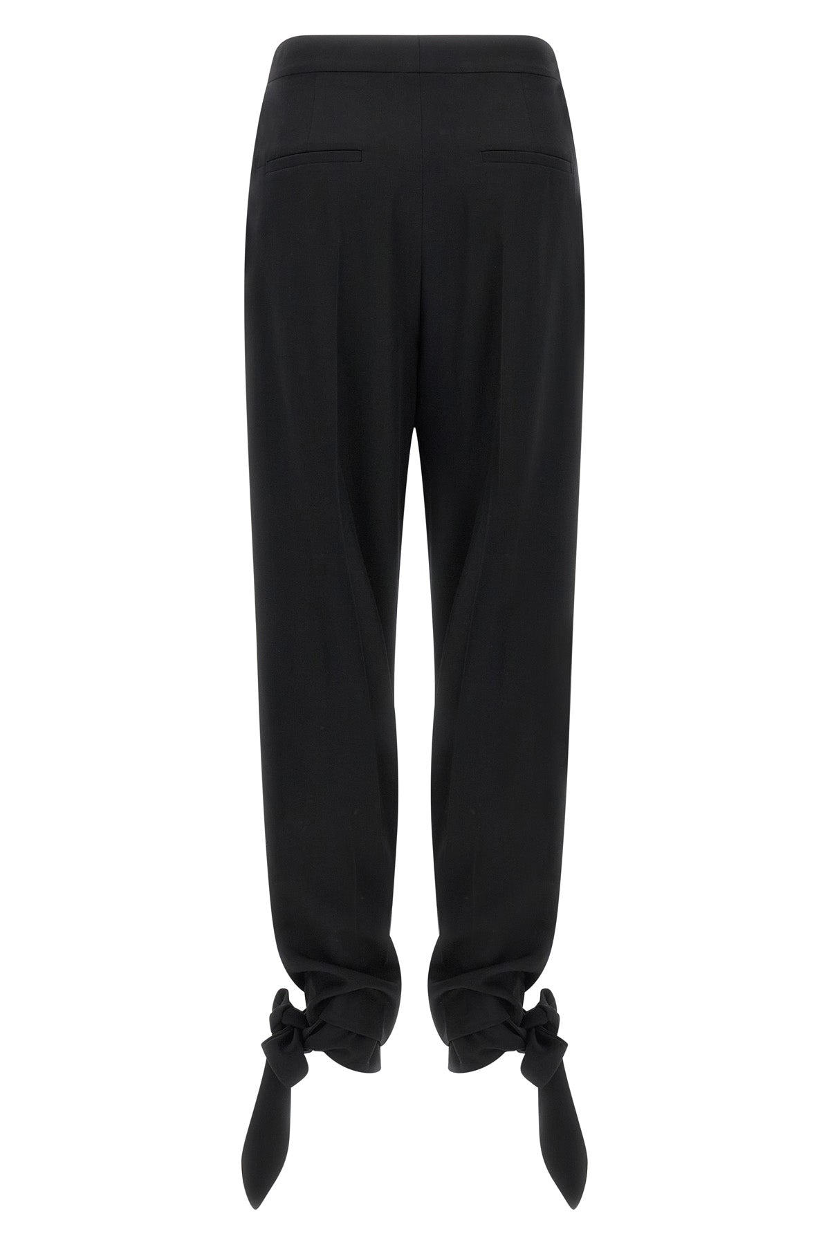 chloé trousers redefine contemporary tailoring through fluid volumes and unexpec