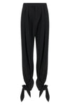 chloé trousers redefine contemporary tailoring through fluid volumes and unexpec