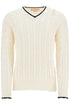 white cotton sweater with cable knit v-neck