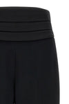 the tuxedo-inspired trousers by ermanno scervino define a slender silhouette thr