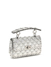 rockstud handbag in laminated leather