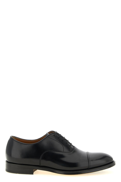 doucals brogue-style lace-up shoes in smooth calf leather