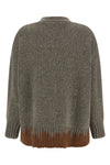 the tela tawan cardigan redefines contemporary knitwear through a bold play of c