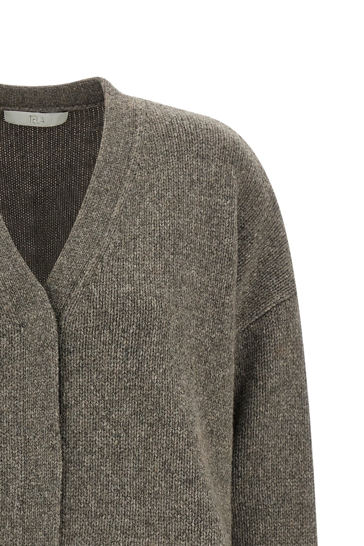 the tela tawan cardigan redefines contemporary knitwear through a bold play of c