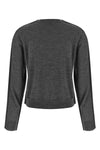 the winny canvas cardigan redefines essential knitwear through unexpected stru