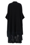 the dolce & gabbana bouclé cape stands out for its large volume