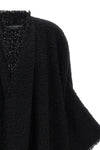 the dolce & gabbana bouclé cape stands out for its large volume