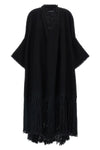 the dolce & gabbana bouclé cape stands out for its large volume