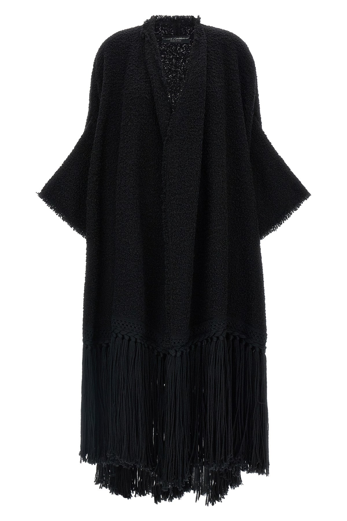 the dolce & gabbana bouclé cape stands out for its large volume