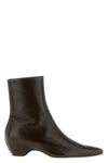 khaite sybil ankle boots redefine the classic silhouette through architectural