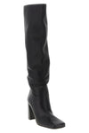 the khaite petra boot redefines vertical elegance through a rigorous silhouett