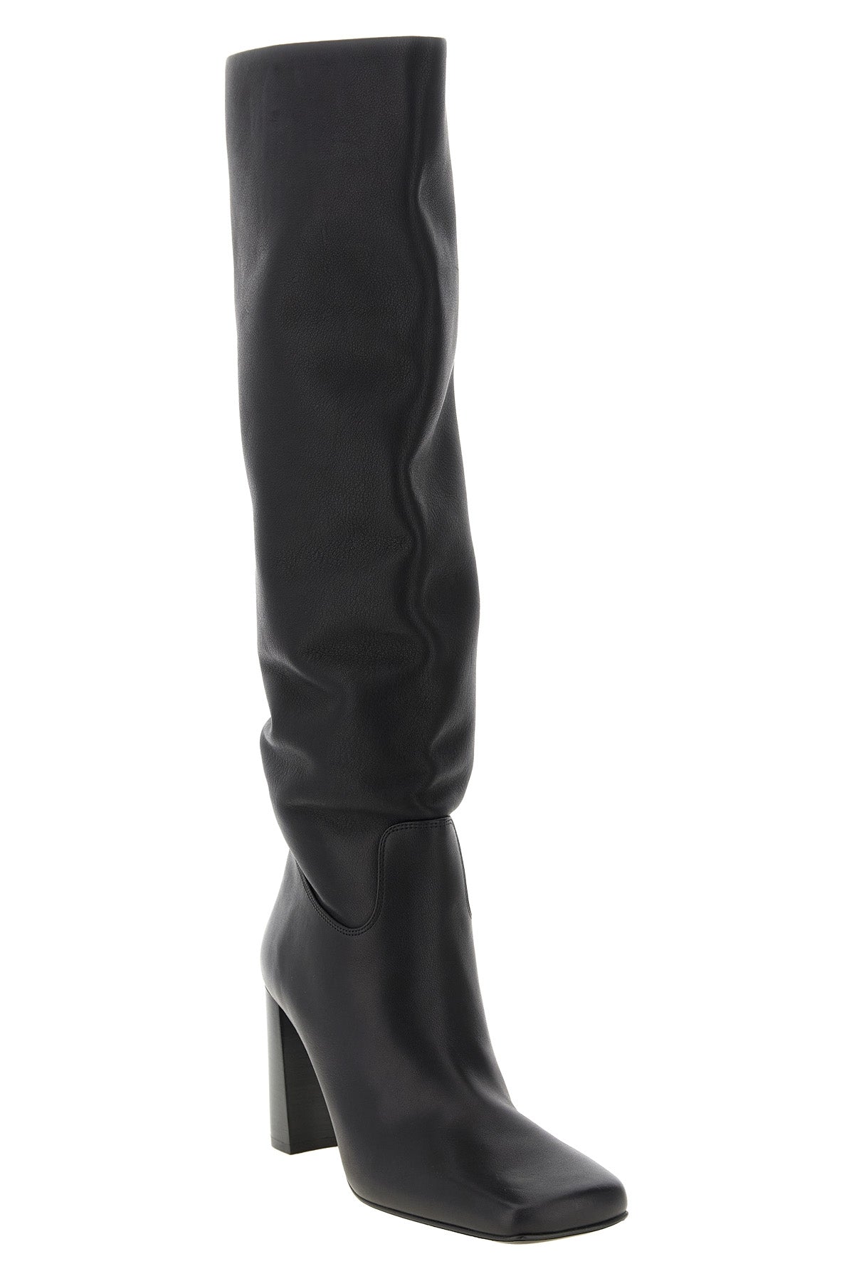 the khaite petra boot redefines vertical elegance through a rigorous silhouett