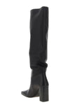 the khaite petra boot redefines vertical elegance through a rigorous silhouett