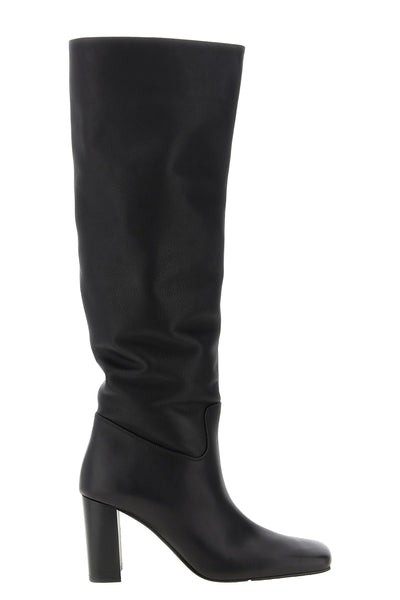 the khaite petra boot redefines vertical elegance through a rigorous silhouett