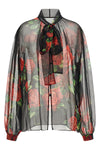 the dolce&gabbana blouse embodies the essence of femininity through impeccable s