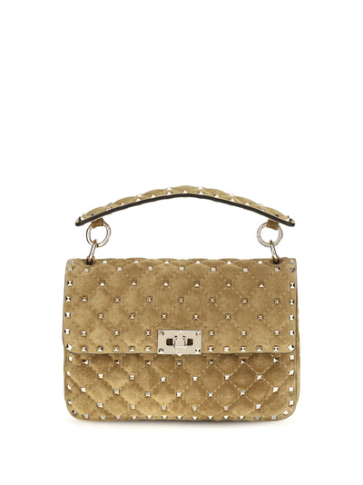 medium rockstud spike suede top handle bag