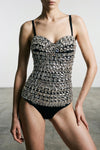 the dolce & gabbana bodysuit creates a sculptural silhouette through its precise