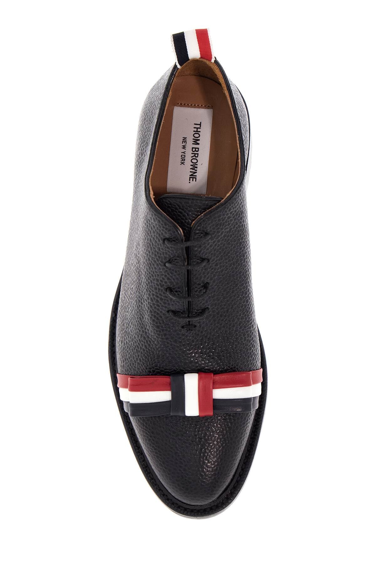 elegant wholecut shoes in black calfskin with rwb bow