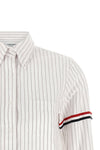 the thom browne cropped shirt reinterprets the codes of classic tailoring throug