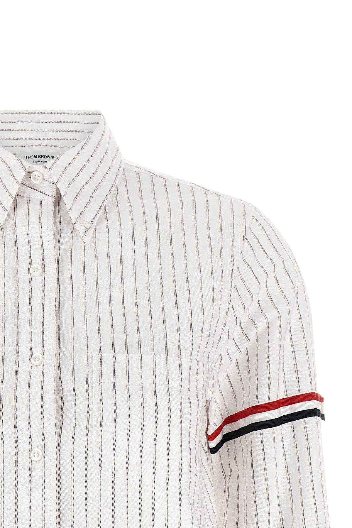 the thom browne cropped shirt reinterprets the codes of classic tailoring throug
