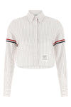 the thom browne cropped shirt reinterprets the codes of classic tailoring throug