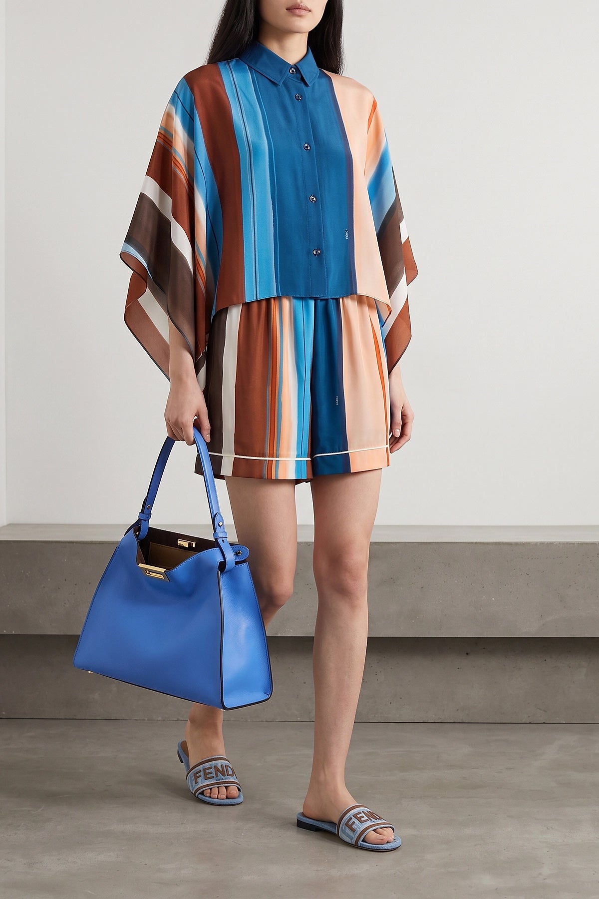 the fendi shirt redefines sartorial volumes through a crop silhouette and wide s