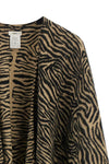 the fendi poncho defines the silhouette through fluid volumes and an open constr
