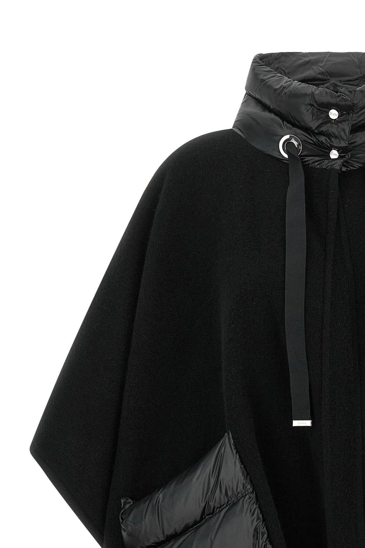 the herno resort poncho redefines the codes of outerwear through a sophisticat