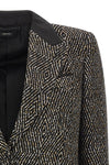 the tom ford jacket redefines the codes of formal tailoring through a shortened