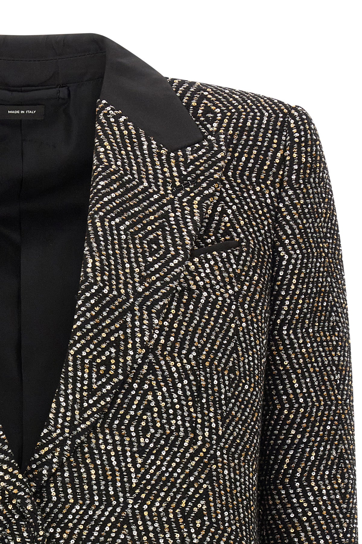 the tom ford jacket redefines the codes of formal tailoring through a shortened