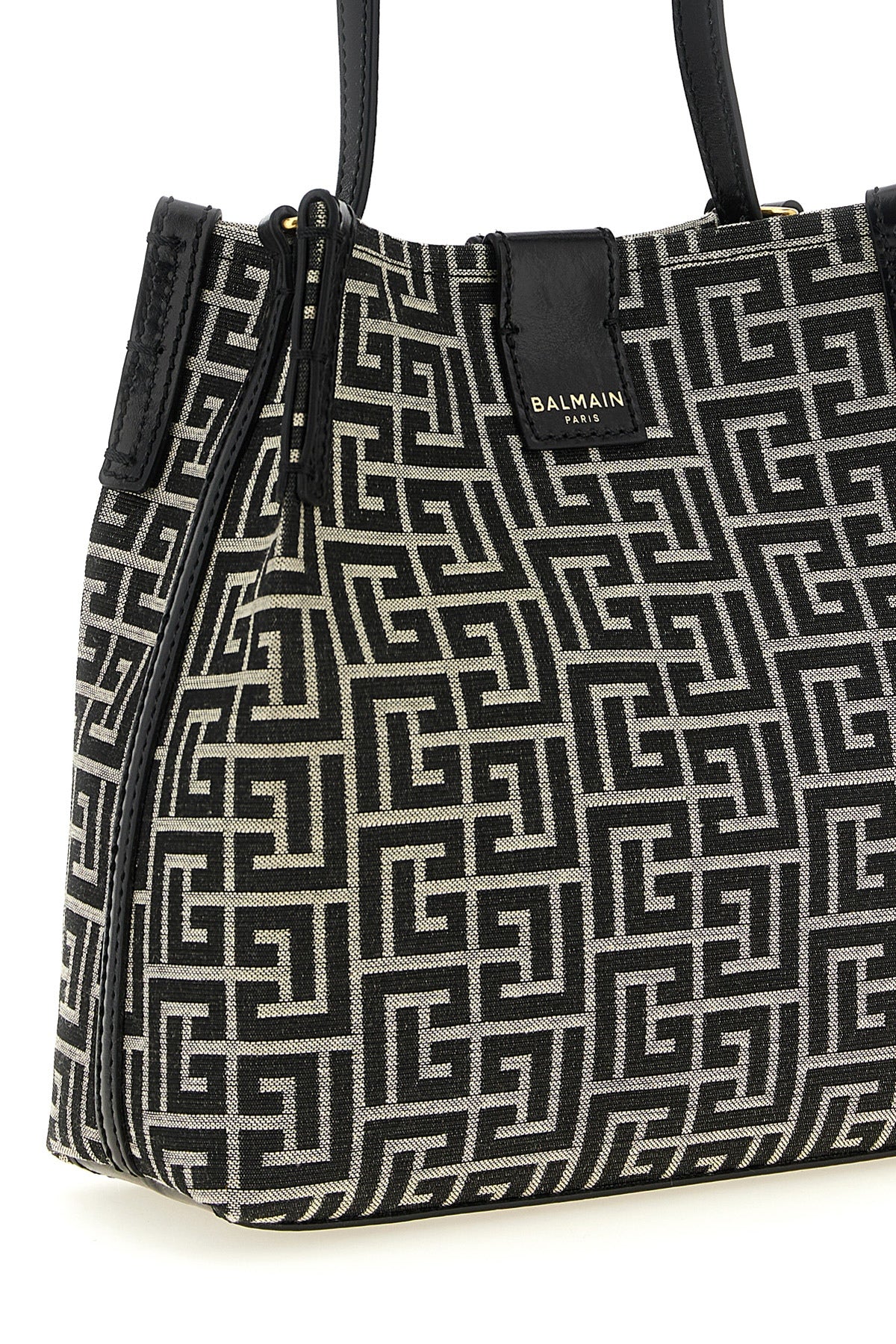 the balmain release bucket bag defines a structured silhouette through a compa