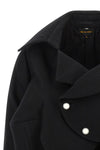 the comme des garçons blazer redefines traditional tailoring through an asymmetr