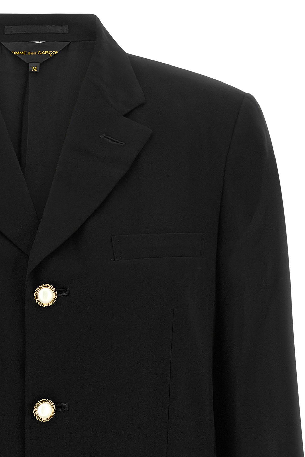 the comme des garçons single-breasted blazer redefines classic tailoring through