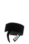 the comme des garcons headband is distinguished by an asymmetrical and sculptura